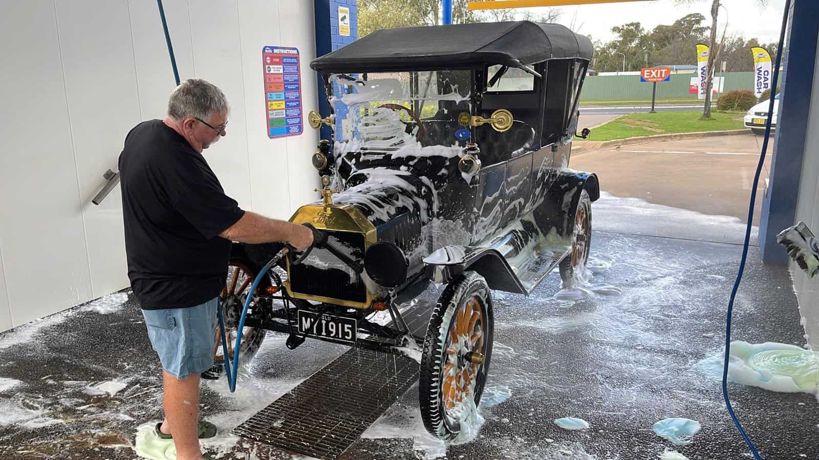 Customer washing their vintage car at a Coffs Harbour's Car Lovers Express car wash