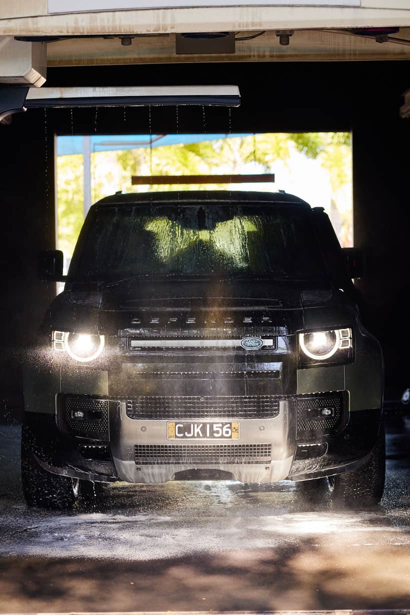 Land Rover Defender while being serviced at a Touch-free Car Lovers Express car wash